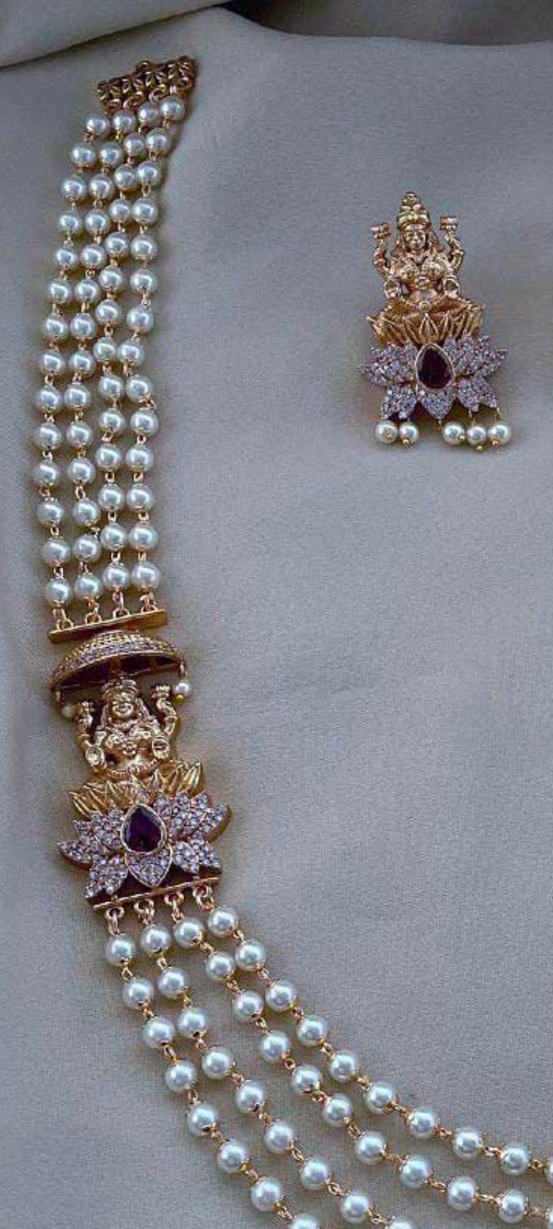 Multi strand pearl haram with lakshmi side pendant